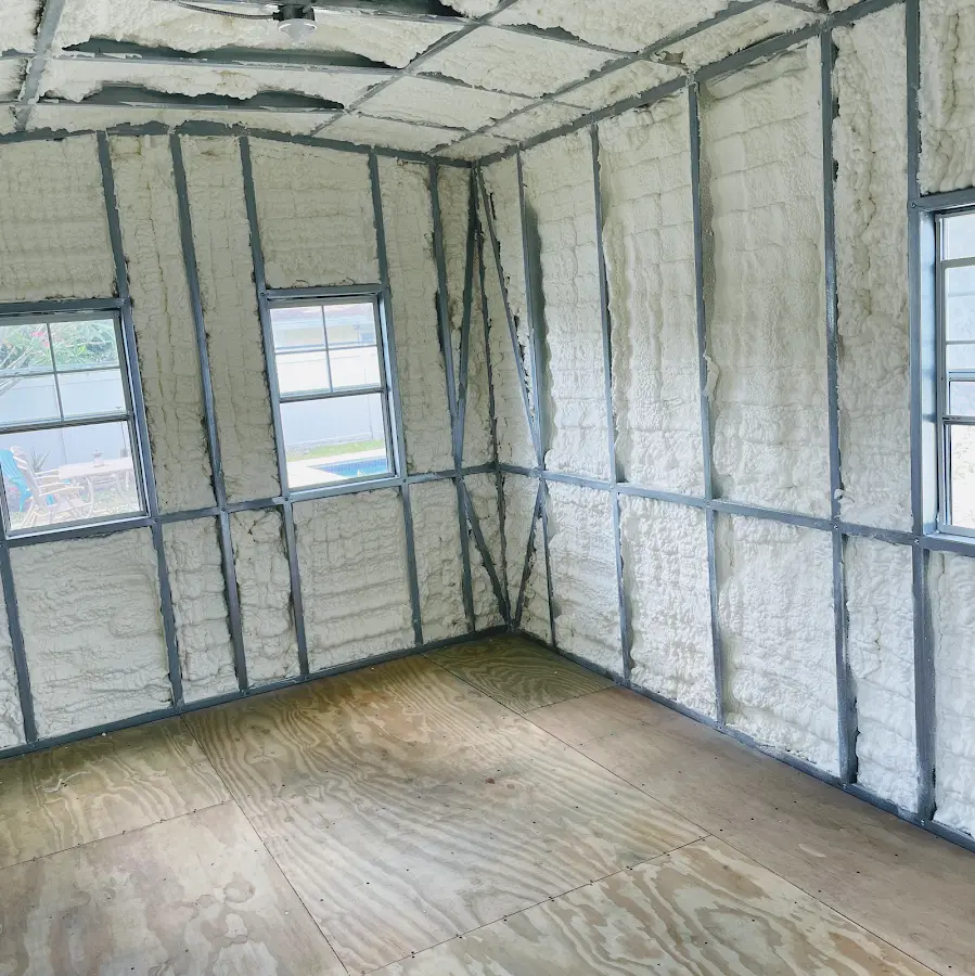 Closed-cell spray foam insulation applied to wall cavities in a residential project in Houghton